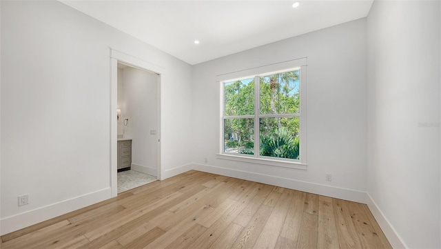 unfurnished room featuring light hardwood / wood-style flooring