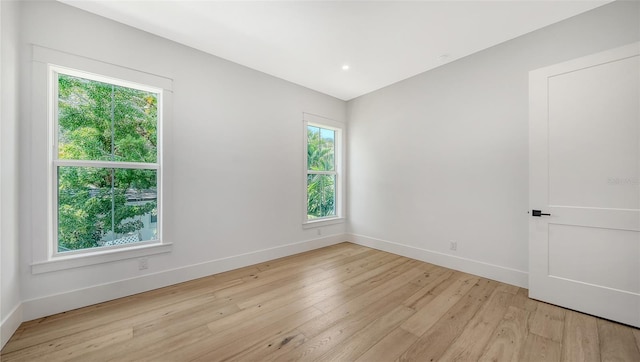 empty room with a healthy amount of sunlight and light wood-type flooring