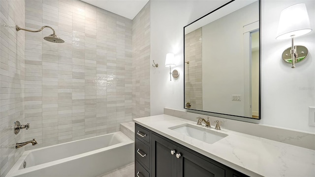 bathroom with vanity and tiled shower / bath combo