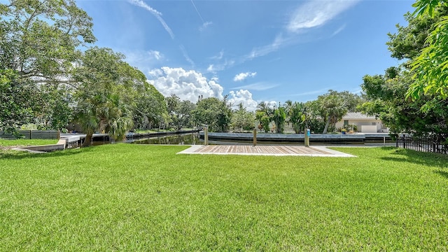 surrounding community featuring a yard and a water view