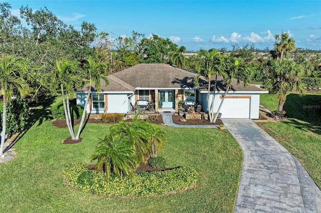 ranch-style house with a garage and a front lawn