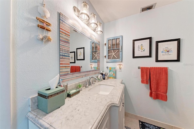 bathroom featuring vanity and tile patterned flooring