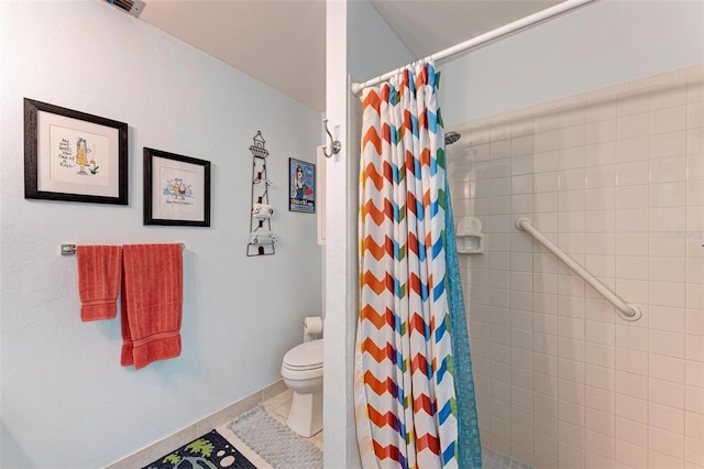 bathroom with tile patterned flooring, toilet, and a shower with shower curtain