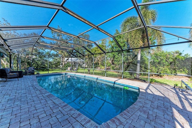 view of pool featuring a lanai and a patio area