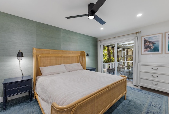 bedroom with ceiling fan, dark hardwood / wood-style floors, and access to outside