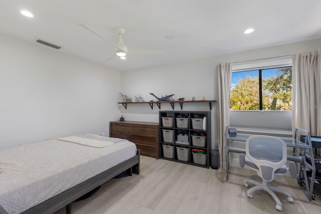 bedroom featuring ceiling fan and light hardwood / wood-style flooring