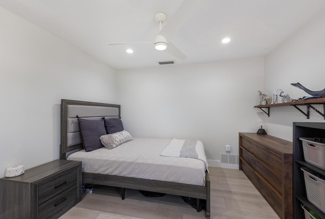 bedroom with light wood-type flooring and ceiling fan