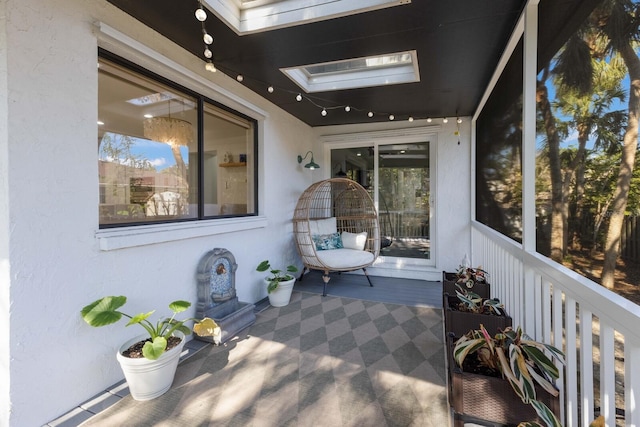 sunroom featuring a skylight