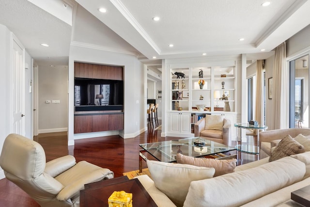 living room with dark hardwood / wood-style floors, a raised ceiling, ornamental molding, and a textured ceiling