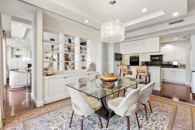 dining room featuring dark hardwood / wood-style floors and ornamental molding