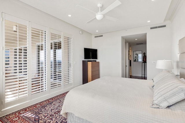 bedroom with ceiling fan and crown molding