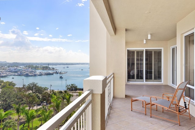 balcony featuring a water view