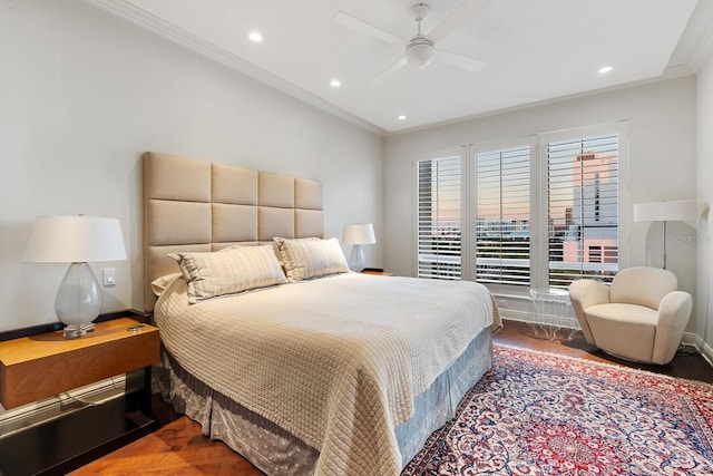 bedroom featuring hardwood / wood-style flooring, ceiling fan, and ornamental molding