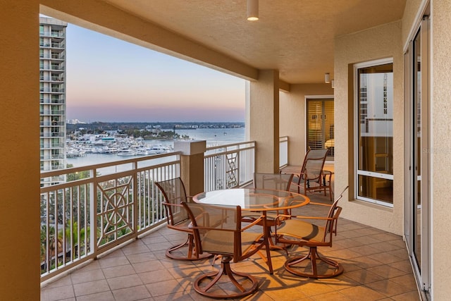 balcony at dusk with a water view