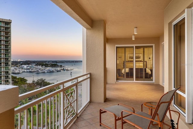 balcony at dusk with a water view