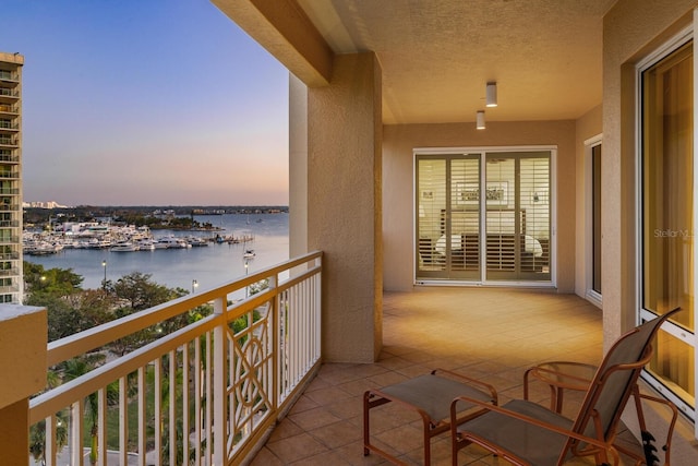 balcony at dusk with a water view