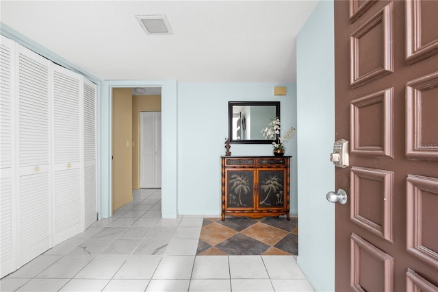 view of tiled entrance foyer