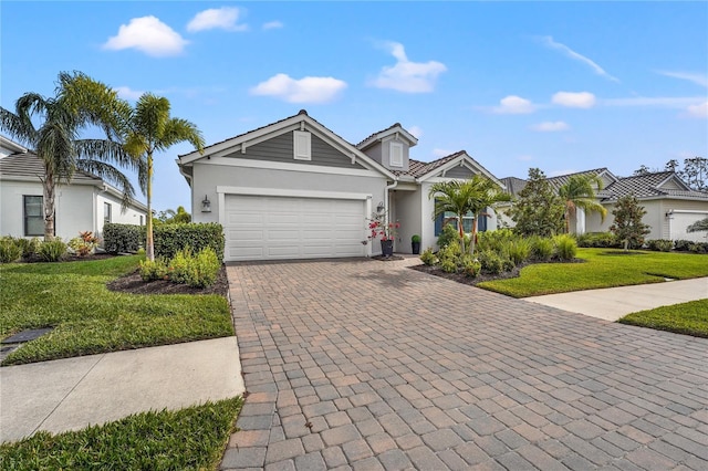 view of front of home with a garage and a front lawn