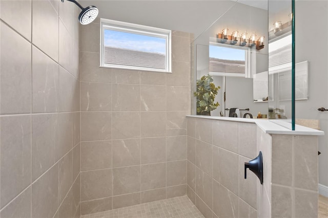 bathroom featuring a tile shower