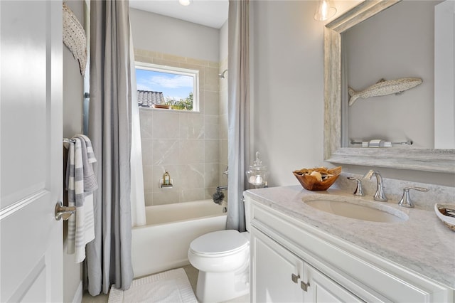 full bathroom featuring vanity, toilet, and shower / tub combo