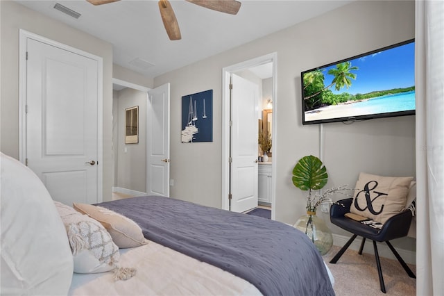 bedroom with carpet flooring, connected bathroom, and ceiling fan