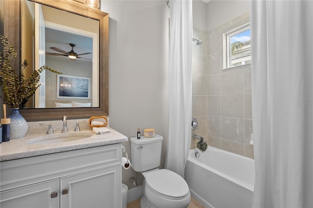 full bathroom with ceiling fan, vanity, shower / tub combo, and toilet