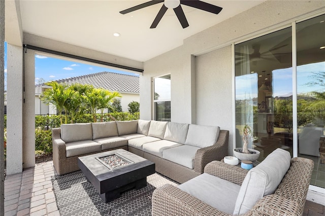 view of patio / terrace with an outdoor living space with a fire pit