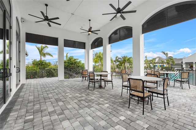 view of patio / terrace with ceiling fan and a community pool