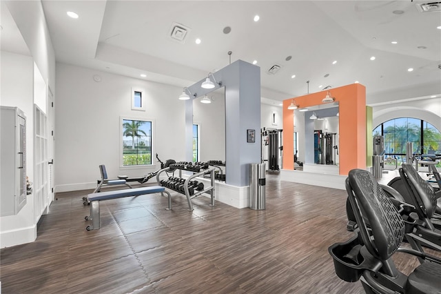 gym featuring a towering ceiling