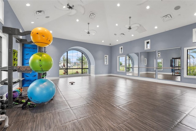 exercise room with a wealth of natural light and high vaulted ceiling