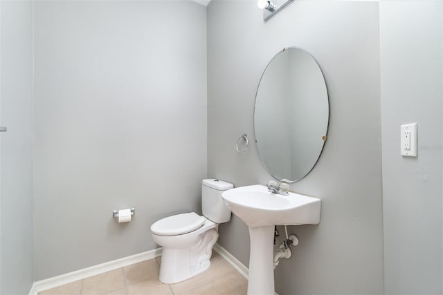 bathroom featuring tile patterned flooring and toilet