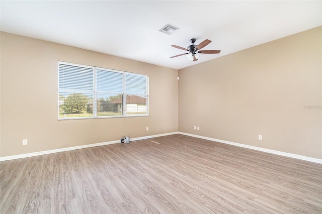 unfurnished room featuring light hardwood / wood-style flooring and ceiling fan