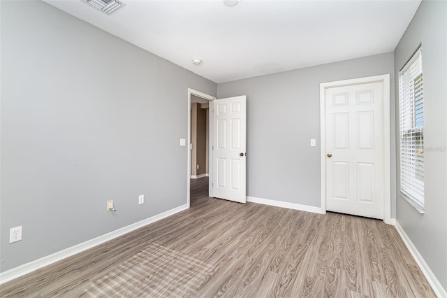 unfurnished bedroom with light hardwood / wood-style floors