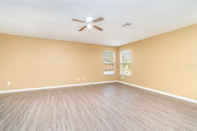 spare room featuring ceiling fan and light wood-type flooring