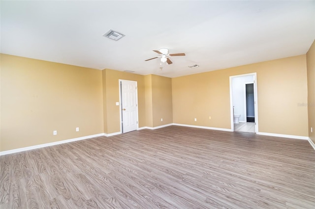 unfurnished room with light wood-type flooring and ceiling fan