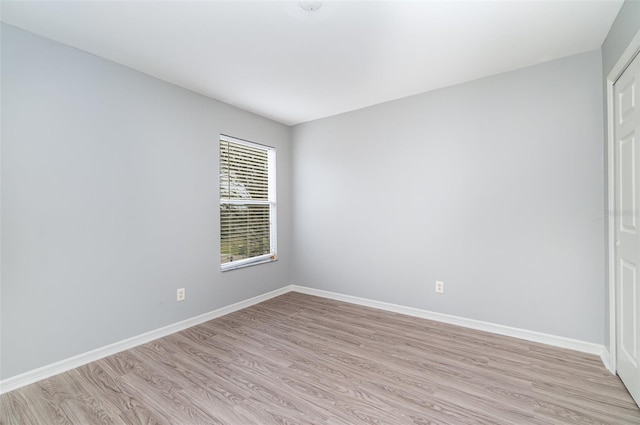 spare room featuring light hardwood / wood-style flooring