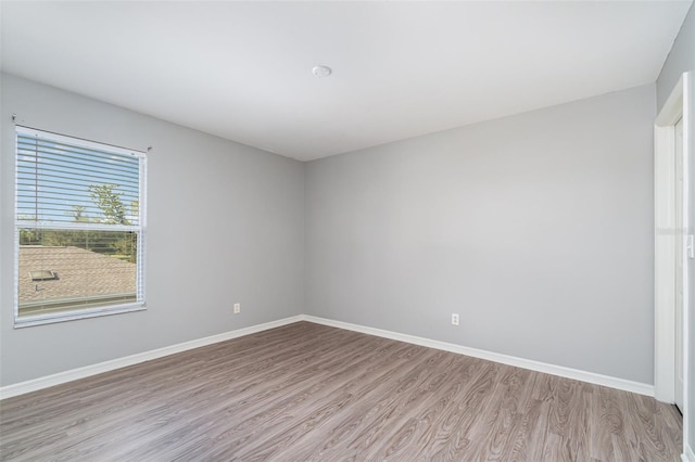 empty room with light wood-type flooring