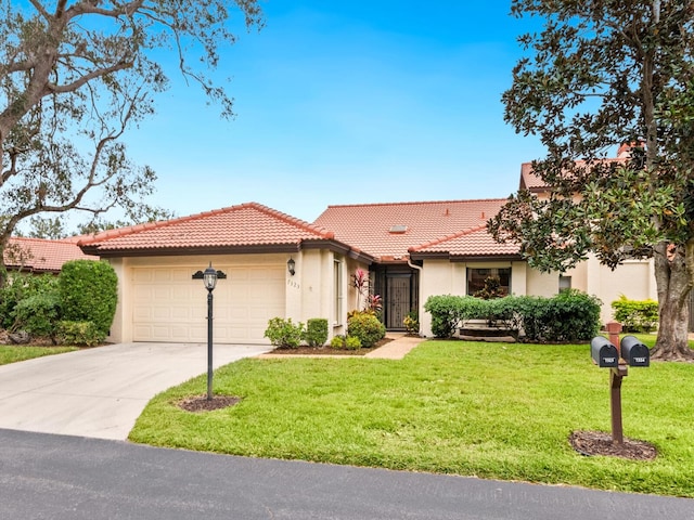 mediterranean / spanish-style house with a garage and a front yard