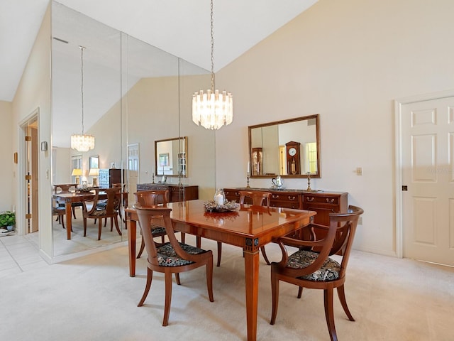 carpeted dining room with high vaulted ceiling and a notable chandelier