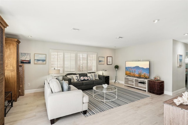 living room with light hardwood / wood-style floors