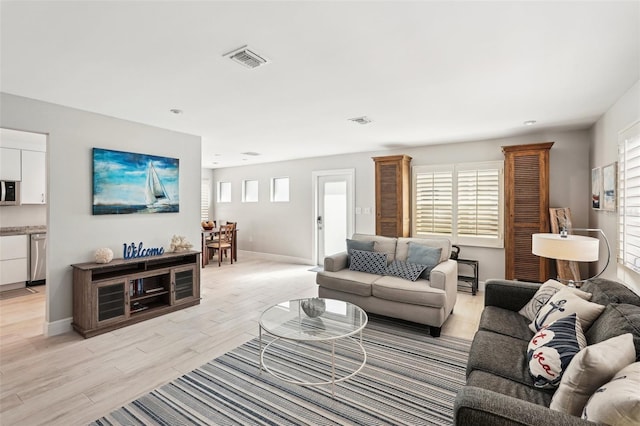 living room featuring plenty of natural light