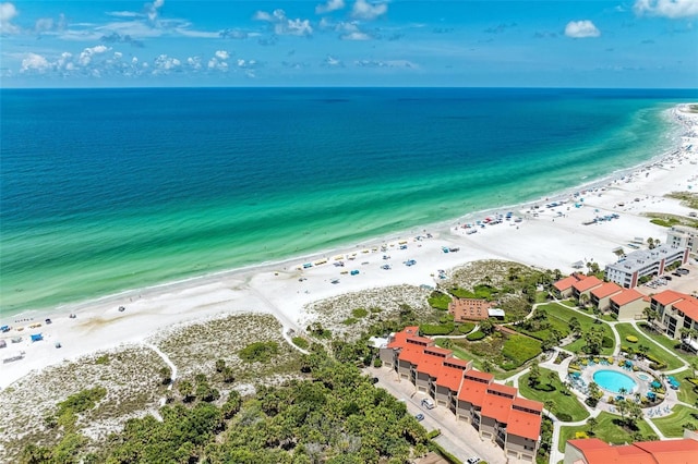 bird's eye view with a water view and a view of the beach