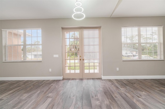 entryway with french doors and hardwood / wood-style flooring