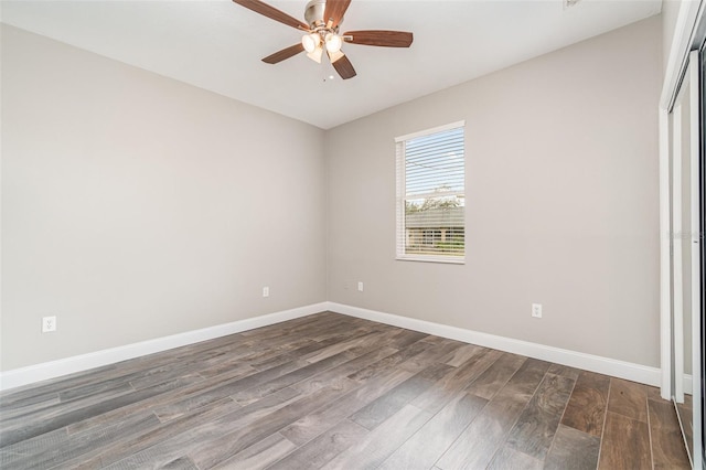 unfurnished bedroom with ceiling fan, dark hardwood / wood-style flooring, and a closet