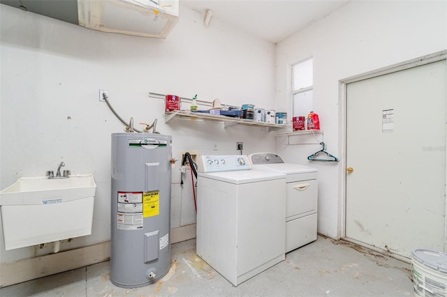 washroom with independent washer and dryer, electric water heater, and sink