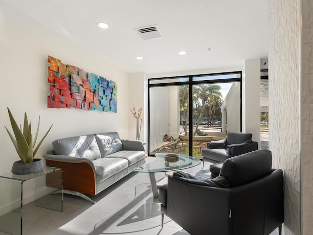 living area featuring recessed lighting, visible vents, baseboards, and tile patterned floors