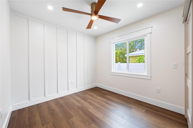 spare room with ceiling fan and hardwood / wood-style flooring