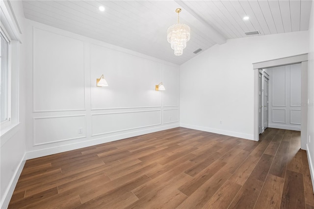 unfurnished room featuring dark hardwood / wood-style flooring, an inviting chandelier, and vaulted ceiling with beams