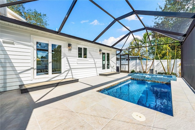 view of swimming pool featuring a lanai and a patio