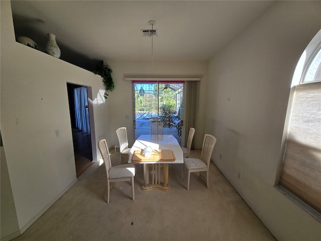 dining area with light colored carpet